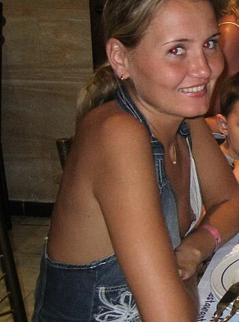 "Fucking hot chick with tits out showing off her sexy legs and ass while wearing tight-assed denim overalls."