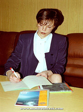 The broad-assed bitch is scribbling in a fucking notebook while she sits her fat ass down on that stool, legs spread wide like she's trying to get a tan or some shit.