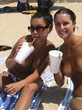 Nudist girls take a drink at the beach  - Photo 48