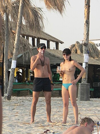 Nudist girls take a drink at the beach  - Photo 61