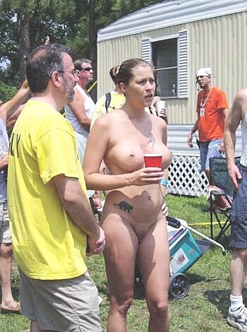 Nudist girls take a drink at the beach  - Photo 64
