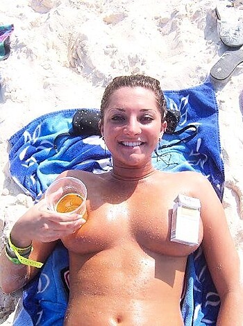 Nudist girls take a drink at the beach  - Photo 69