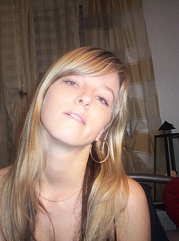 Fucking hot chick sporting a blingy chain around her neck and some fucking earrings.
