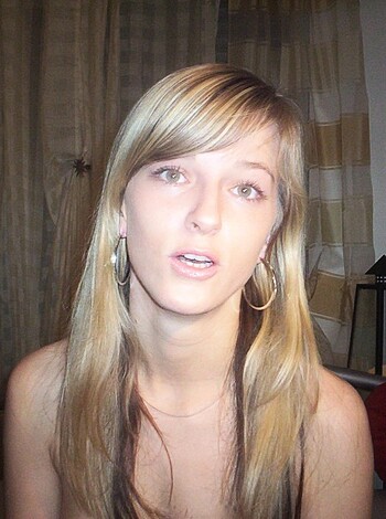 This photo shows tits and some bitch's face.