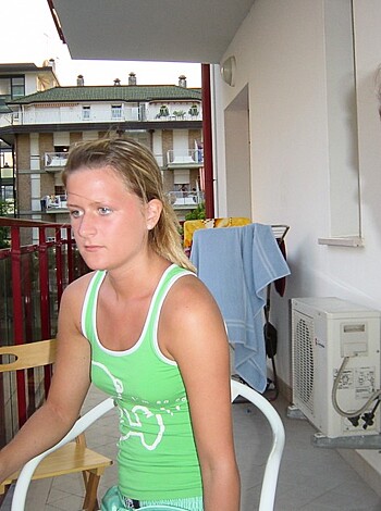 Here's two hot chicks sitting on their asses, staring into the lens like they're about to give some head or something.