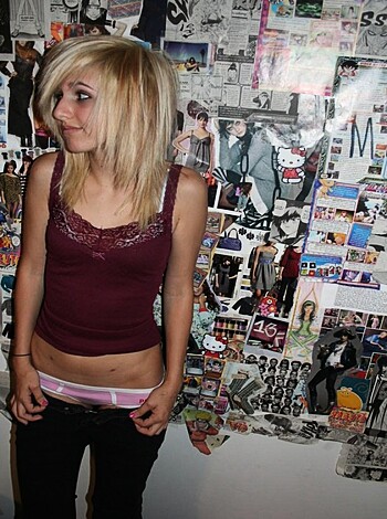 "This picture is fuckin' hot, bitch! Check out this fine-ass chick in her frilly underwear, suckin' on that cigarette like a pro. You ain't gonna forget this image anytime soon, I can tell ya that shit for free."