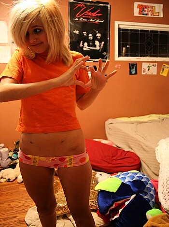 "Look at this dirty-ass bitch flipping off the camera in her goddamn bedroom."