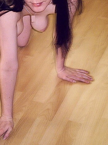 "Here's a picture of a naked chick with her pussy all out and she's got her hand on her thigh."
