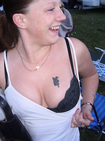 A fucking wasted bitch with boobs out for grabs is all over the place in this photo.