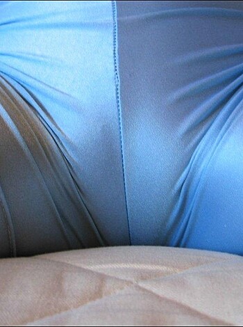 Here's a f**king hot picture of some cunt in a tight blue bikini, flaunting her goddamn ass like a motherf***ing slut.