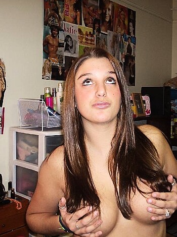 Woman covering her tits with her palms.