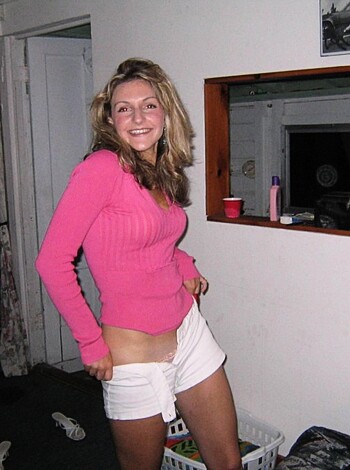"Here's an image of some chick with no clothes on, just leanin' up against a wall."