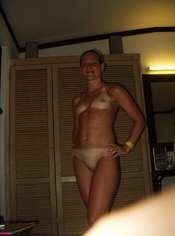 "Fucking hot chick showing off her tight ass titties, with a smile on her face."