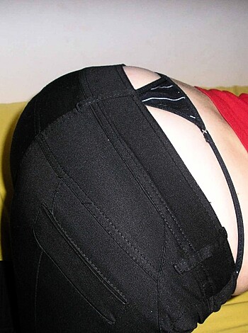 """
An uncensored shot of some fine ass, clad in sexy black stockings and a cheeky little thong.
"""