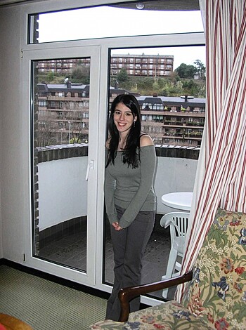 "Here's a fat cunt bitch posin' all sexy-like in some shithole motel, lookin' out the fuckin' window at all the other shitpiles below her. Fuck knows what she's grinnin' about - probably just got fisted by some guy with a knob like a damn tree trunk."