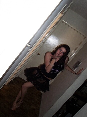 "Here's a hot babe dressed in sexy black lingerie showing off her tits and ass."