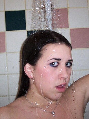 Here's a picture of a babe taking a hot shower with the water running hard and fast, making it look like she's getting fucked by the spray.