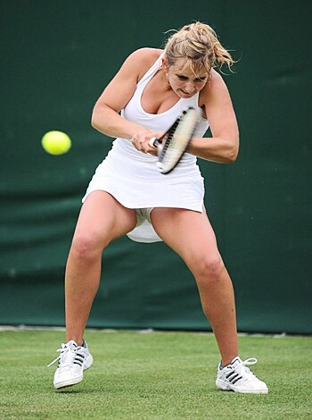 "F*cking hot chick with tight ass showing off her bouncing boobs while serving the f*ck outta that yellow ball on the court."