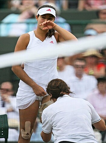 Here it is, a fuckin' photo of some chick wearing a white dress with a visible-as-fuck panty line while trying to fix her skirt.