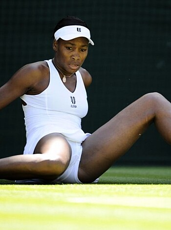 Busty blonde babe with her ass in the air, stretching out her sweaty pussy on the tennis court.