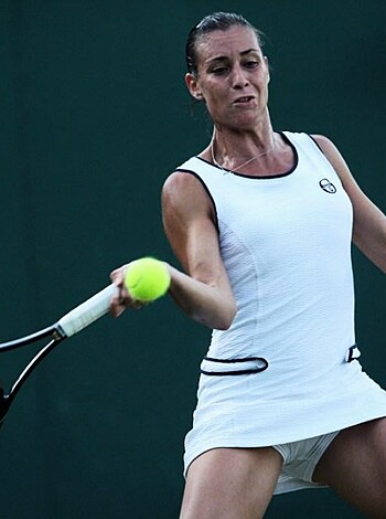 "A nude babe in a tight dress with a fuckin' racket up her ass about to toss the fuckin' ball."