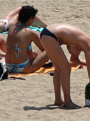 VOYEUR ON THE BEACH - Photo 179