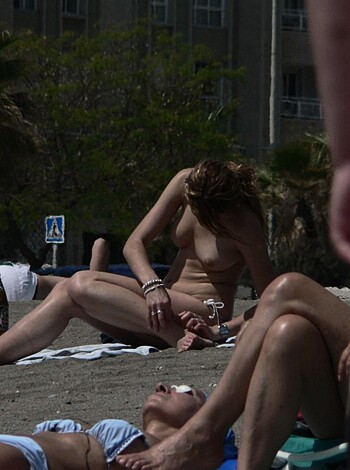 VOYEUR ON THE BEACH - Photo 198