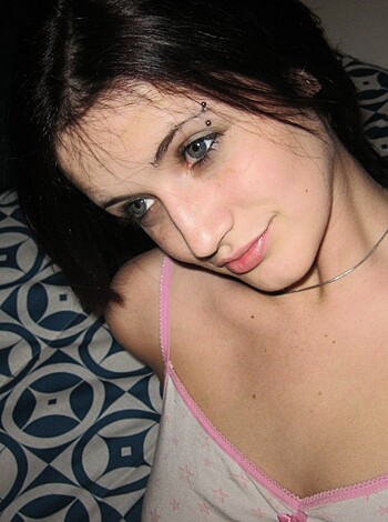 A tight-assed chick in pink lacy underwear poses for the camera.