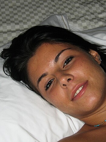 Vulgar description: Look at this hot bitch lying down shirtless with a fucking smile on her face, dick-suckers!