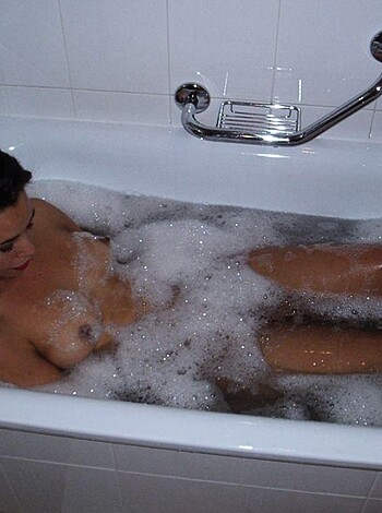 Here's a naked chick soaking her tits in some hot bubble bath, you perv.