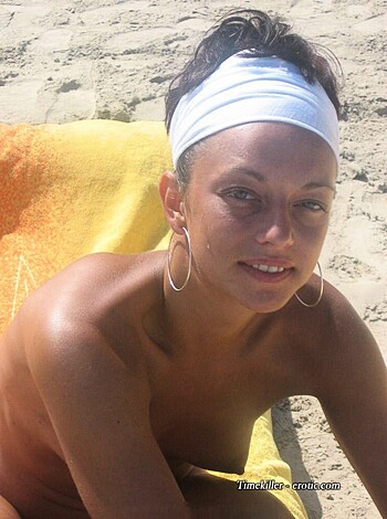 "Here's a fat-assed slut with her tits hanging out, basking in the sun on a flimsy piece of beach garbage."