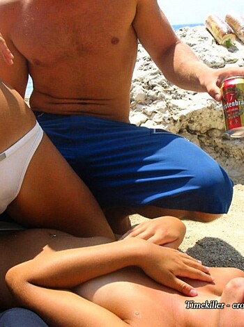 Two bitches loungin' on the sand, soda guy comin' at them hand.