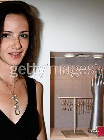 A bitch with a tight ass in a sexy fucking dress, stands next to some expensive-ass bling for all you broke cunts out there drooling over her shit.