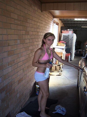 Look at this f***ing hot chick wearing a tiny bikini while holding a f***ing sexy bottle of booze. She's all tanned up, her body is perfect, and she obviously loves to party.