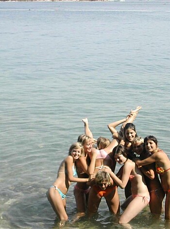 "A pack of hoes frolickin' in the sea, showin' off their bikini bottoms."