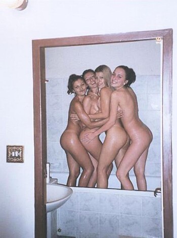 Five fucking hot chicks standing in the goddamn shower room together, fully nude and looking sexy as hell.