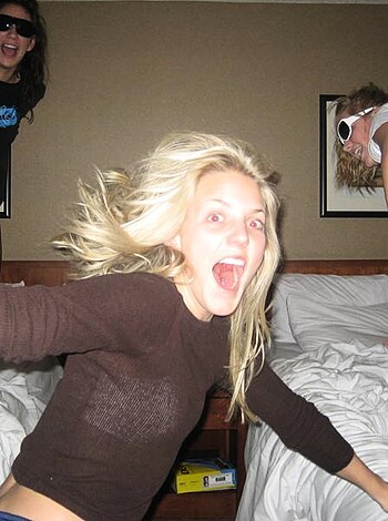A bunch of sluts fuckin' around on some beds while laughin' their asses off like the dumb whores they are.