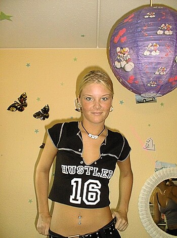 Look at this fucking picture of some hot babe wearing a tight-ass black t-shirt with big white letters that say "FUCK ME" across her chest.