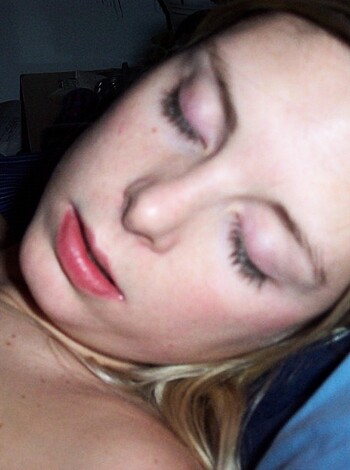 A fuckin' naked bitch passed out on her goddamn bed.