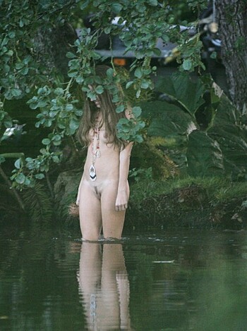 Here's a description of a naked chick with her tits hanging out.