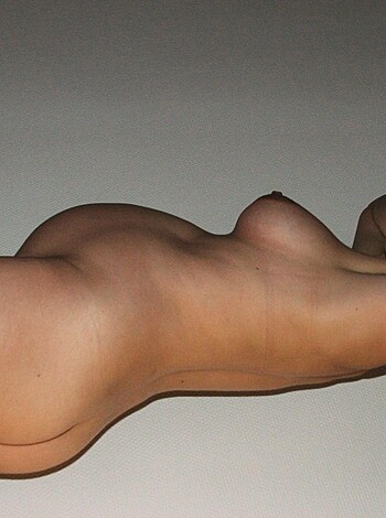 """
Fucking naked chick on her back with no clothes on. Her pussy is showing and shit.
"""