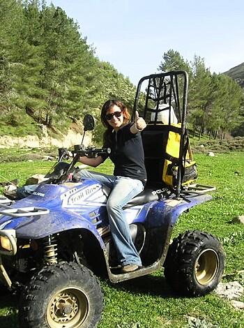 "Here's a picture of some chick sittin' ass-down on a dusty moped, flippin' the bird."