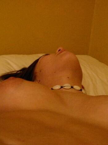 """
A naked tits chick layin' on a fuckin' bed.
"""