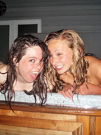 Two fucking naked bitches, giggling like little school girls, all snuggled up in each other's arms while soaking their tits in some goddamn Jacuzzi tub, just having a damned good time.