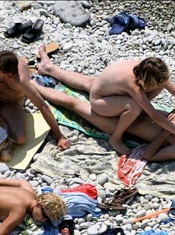 Orgy at a public nude beach - Photo 9