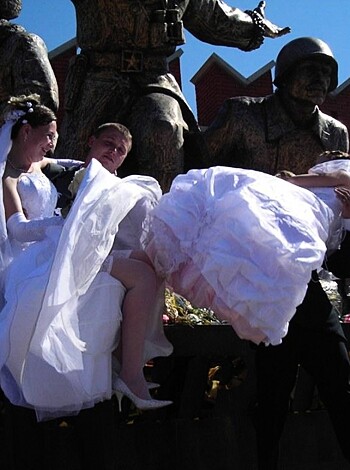 Vulgar description: "Fuckin newlyweds actin like they don't give two fucks about the camera while takin a pic for their Instagram feed, tryin to look all lovey dovey but really just wanna bone each other."