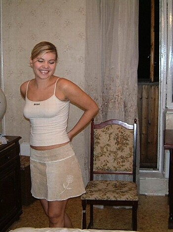 A smokin’ hot blonde babe wearing nothing but her panties, frolicking around like a fuckin’ dumbass.