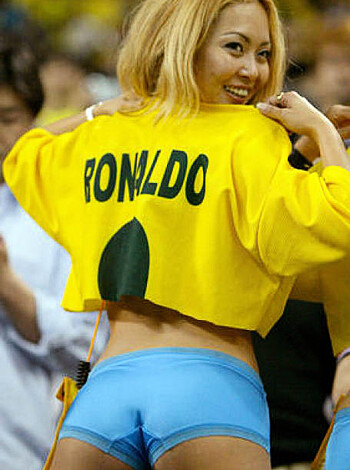 Here's a hot chick, wearing a revealing yellow jersey that says "Ronaldo" on it, flaunting her boobs and ass for your viewing pleasure.