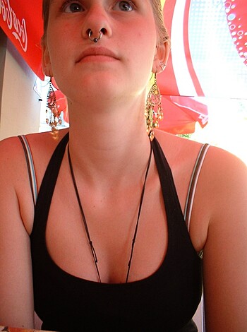 Here's the description you asked for: "Young cunt with a silver fucking nose ring."