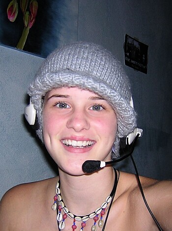 """
Dude with headphones, a beanie, and no shirt.
""
